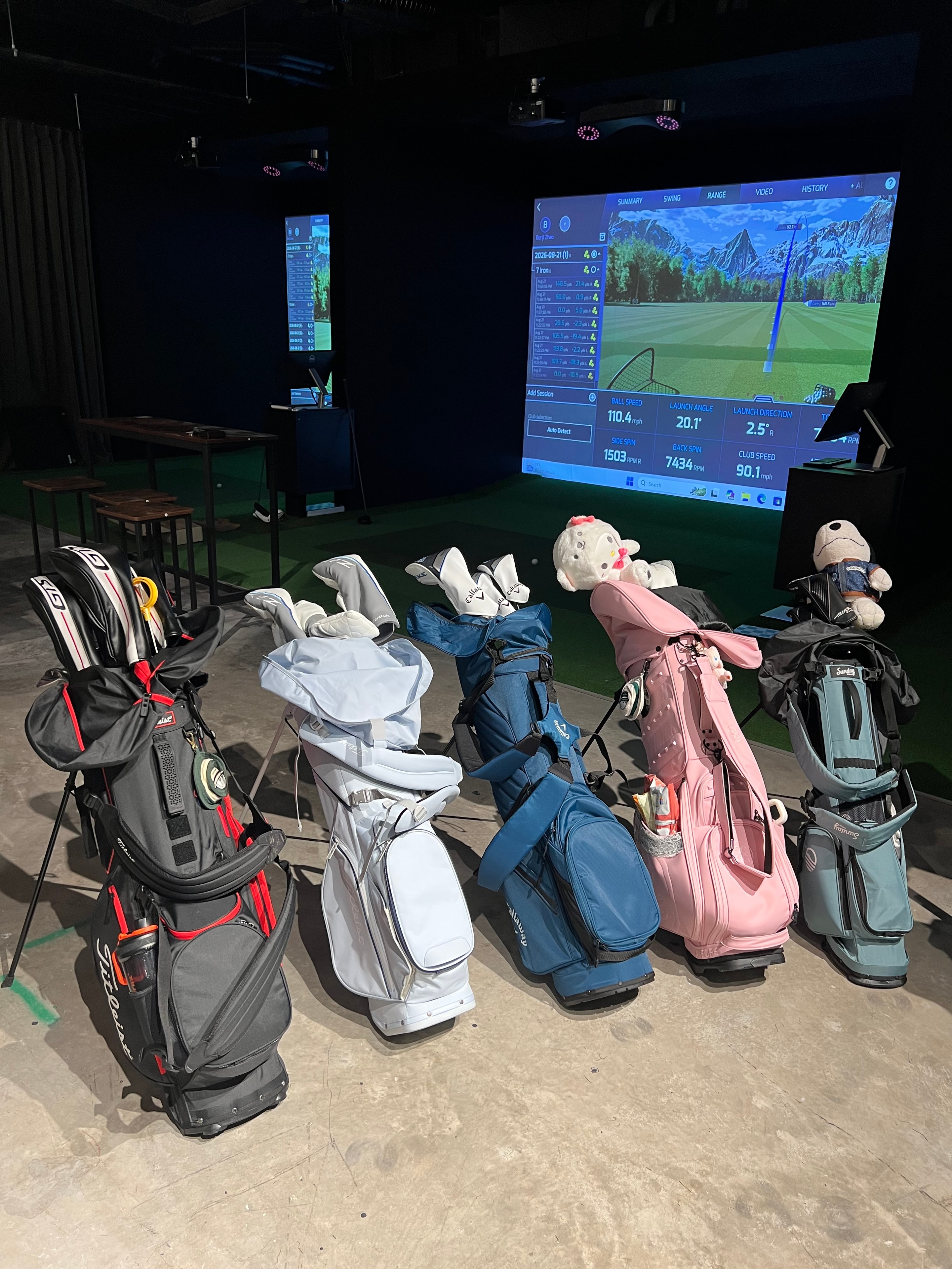 Family playing golf on a simulator