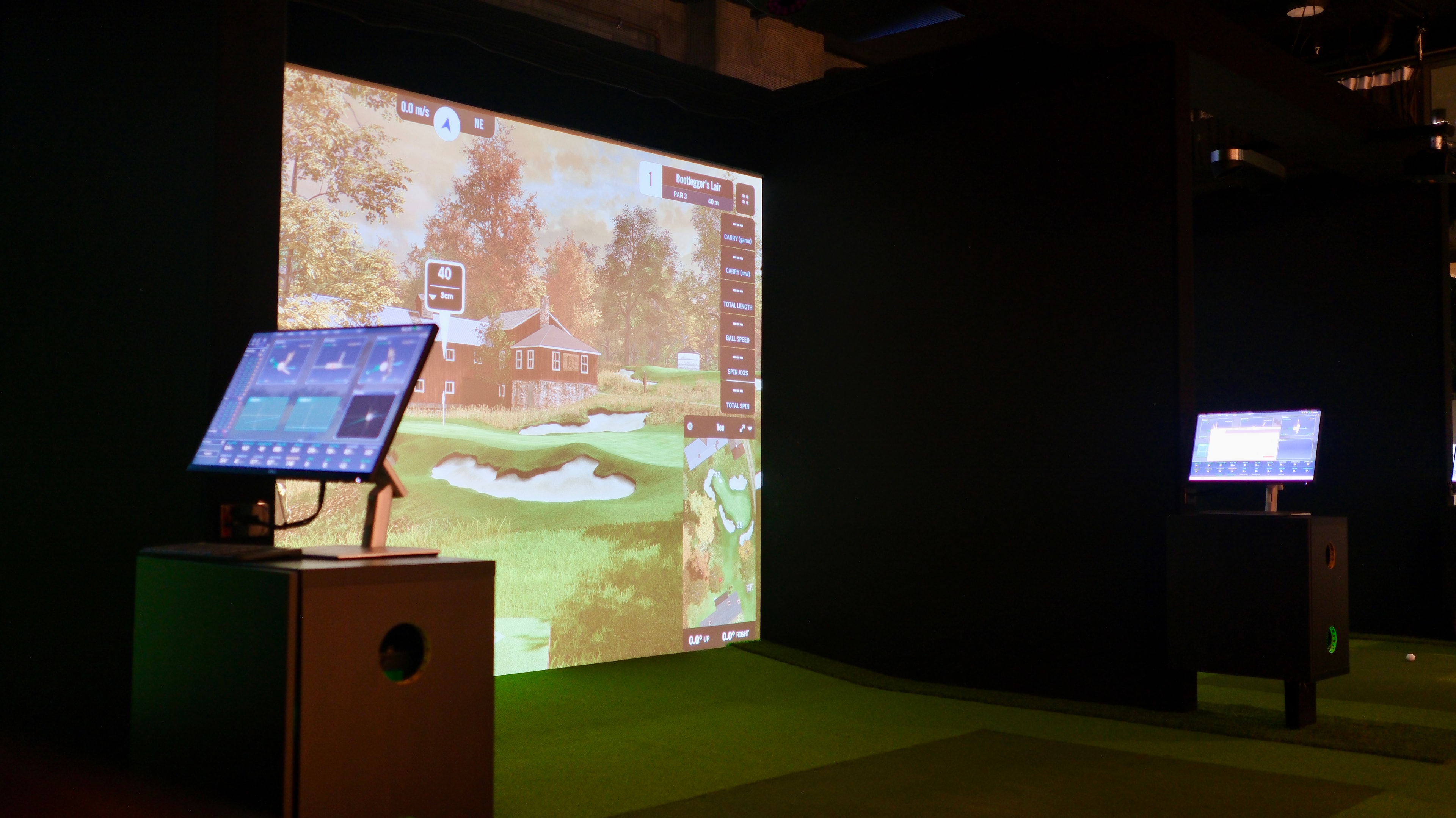 Golfer hitting a shot on the simulator