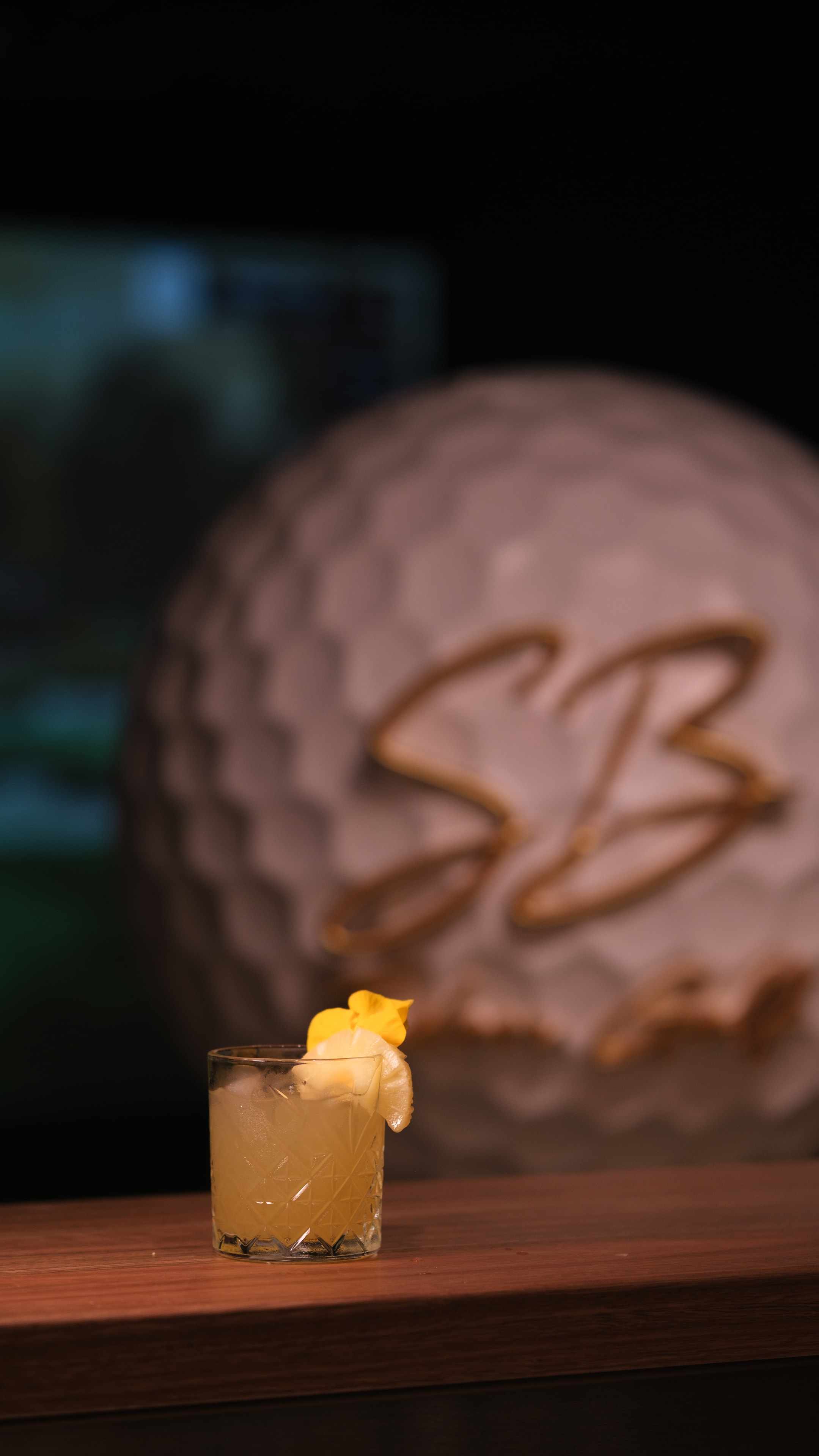 Signature cocktail — citrus with orange garnish